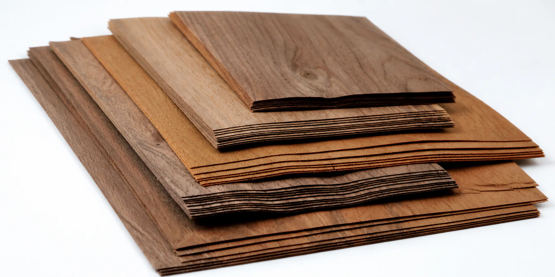 Sheets of natural veneer in different wood species and shades